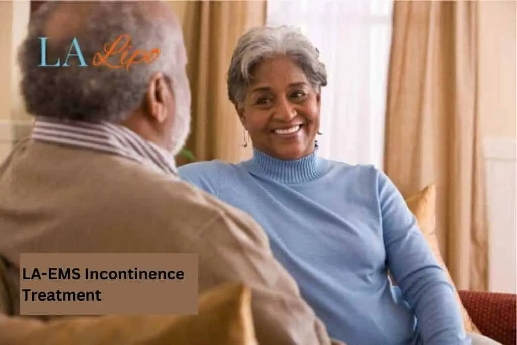 Couple sat smiling at each other - LA-EMS treatment Durham