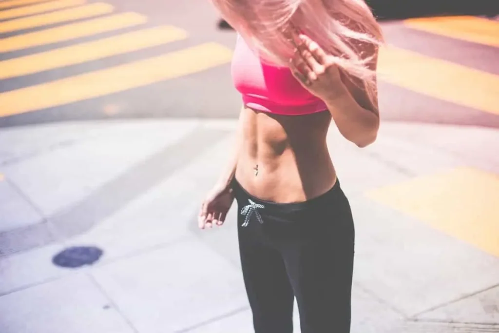 Woman with toned stomach after LA-EMS Body Sculpting Treatment Durham 